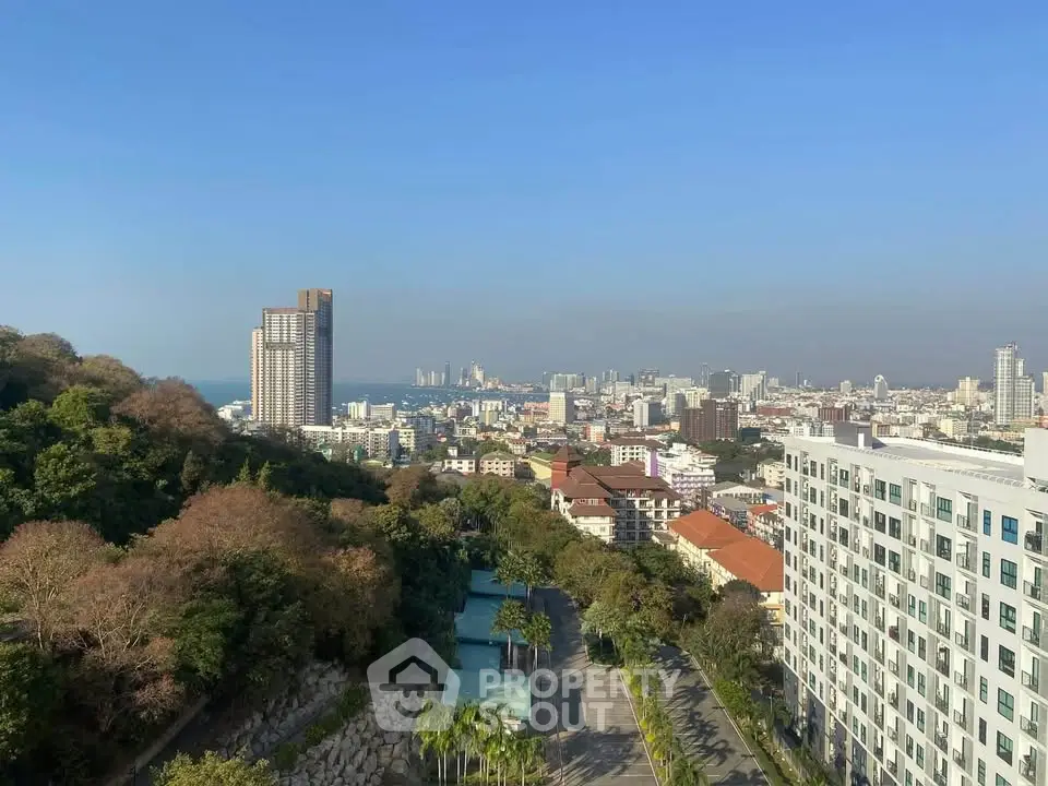 Stunning cityscape view with modern high-rise buildings and lush greenery, perfect for urban living.