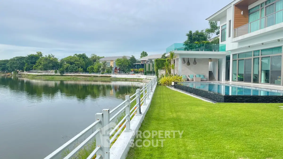 Luxurious lakeside villa with private pool and lush garden