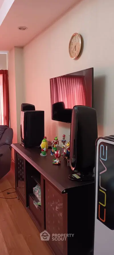 Cozy living room with modern entertainment setup and stylish decor