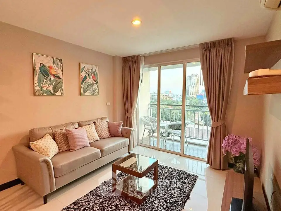Stylish living room with balcony view in modern apartment