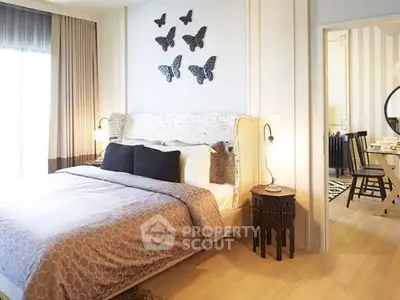 Elegant bedroom with stylish decor and cozy ambiance, featuring butterfly wall art and soft lighting.