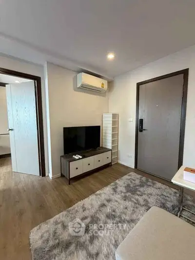 Modern living room with air conditioning and stylish decor in a cozy apartment.