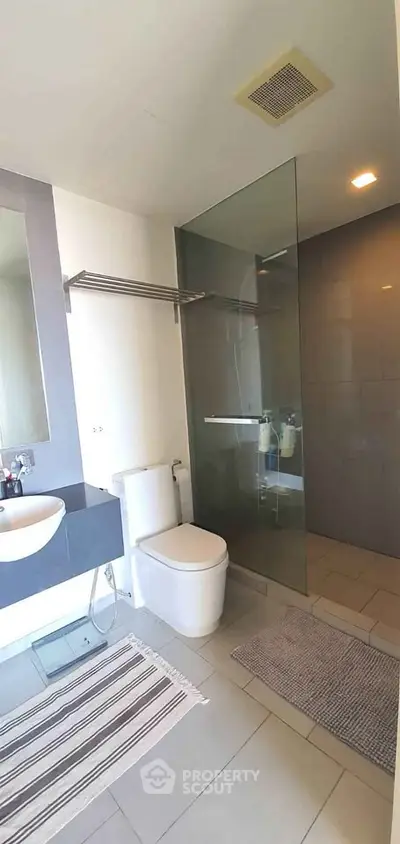 Modern bathroom with sleek glass shower and contemporary fixtures