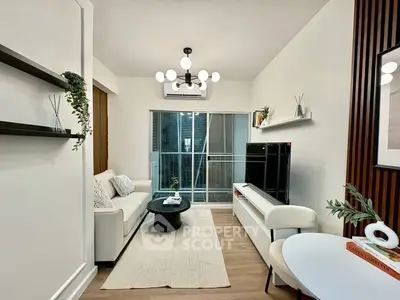 Modern living room with stylish decor and balcony access