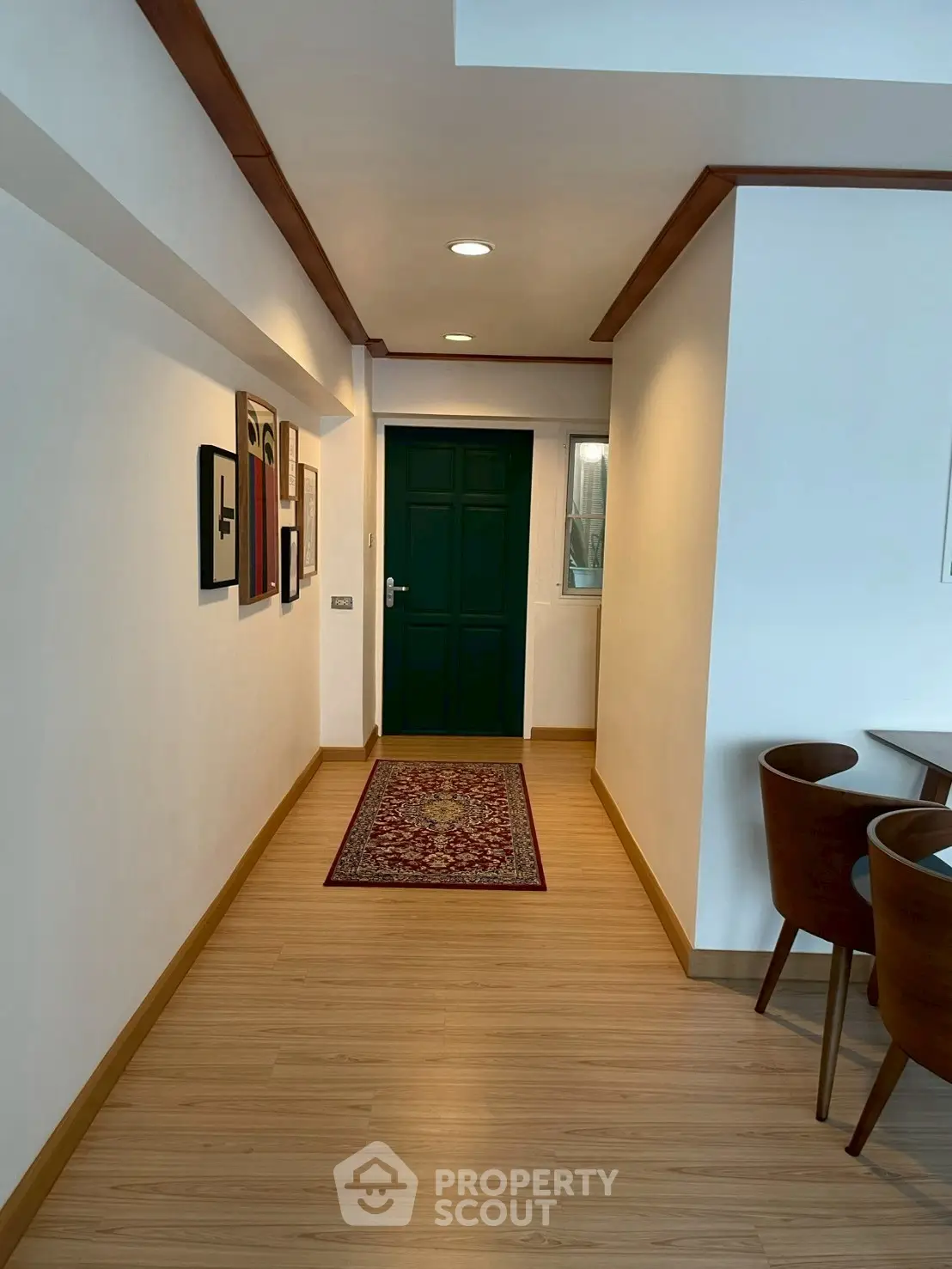 Stylish hallway with wooden flooring and modern decor in a cozy apartment