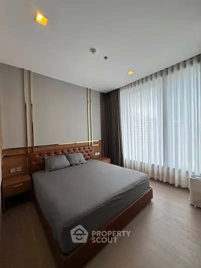 Luxurious bedroom with modern design and large windows for natural light