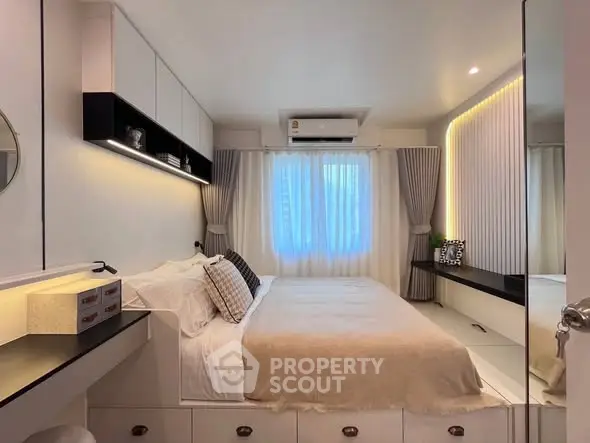 Modern bedroom with elegant lighting and cozy decor