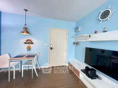 Charming nautical-themed living room with modern decor and wall-mounted TV