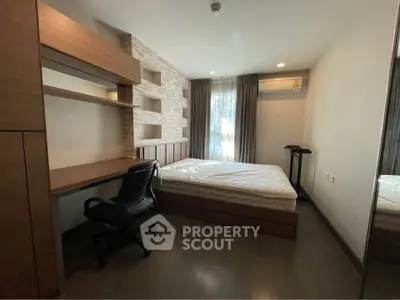 Modern bedroom with built-in desk and stylish shelving