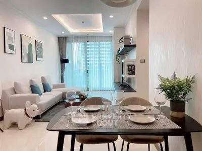Modern living room with elegant dining area and stylish decor