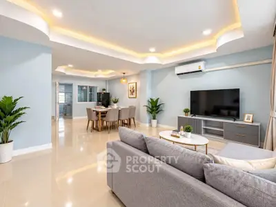 Spacious modern living room with elegant dining area and stylish decor