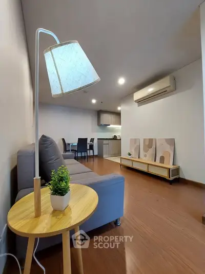 Modern living room with stylish decor and open kitchen layout