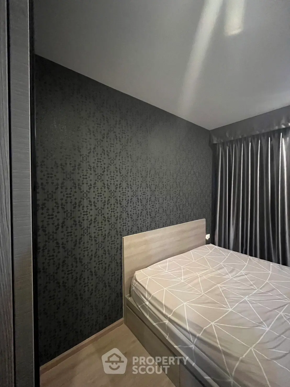 Modern bedroom with stylish wallpaper and sleek curtains