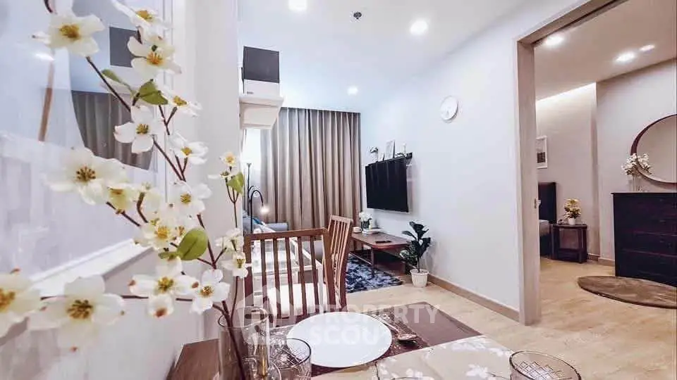 Charming open-plan living and dining area with modern decor and cozy ambiance.