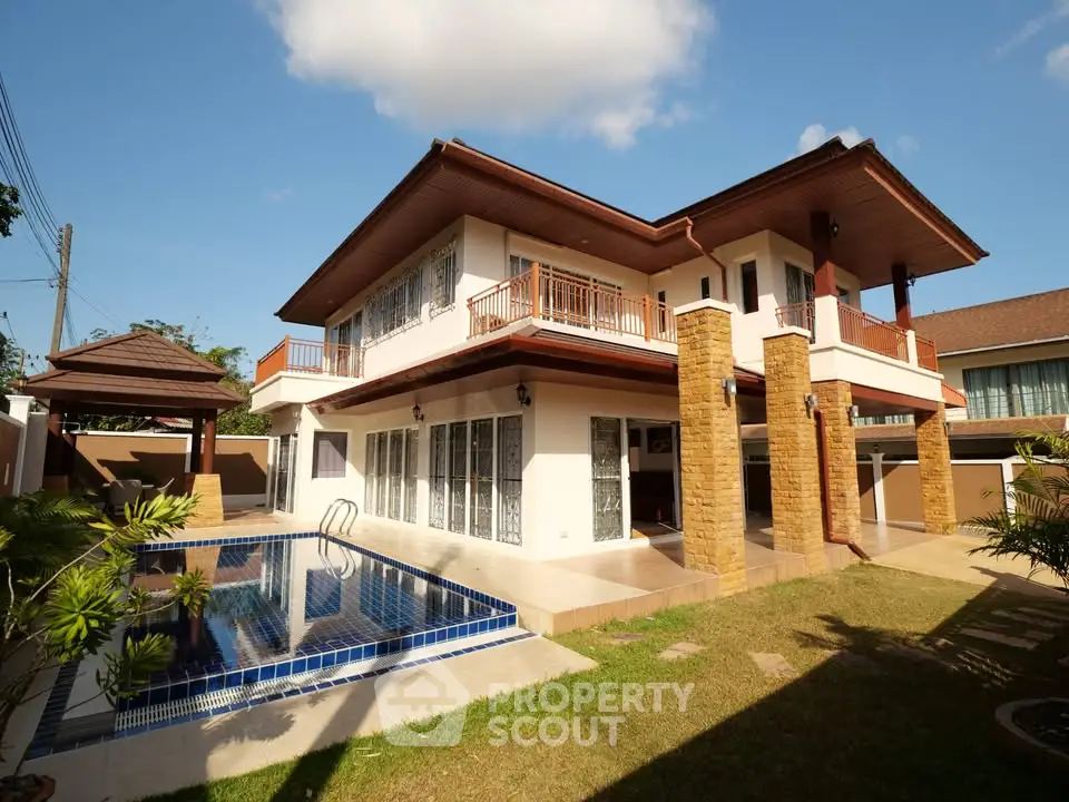 Stunning two-story house with private pool and spacious outdoor area, perfect for luxury living.