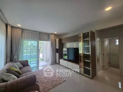 Spacious modern living room with large windows and elegant decor