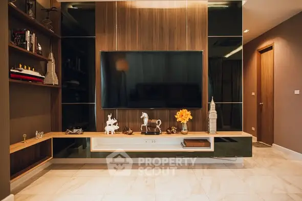 Stylish modern living room with large TV and elegant decor