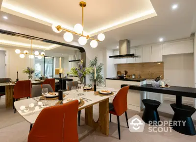 Luxurious modern dining area with elegant lighting and open kitchen layout