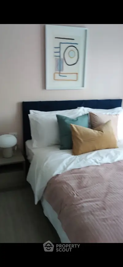 Cozy bedroom with modern decor and stylish bedding