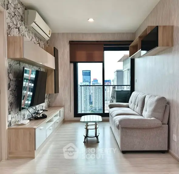 Modern living room with city view, stylish furniture, and natural light.