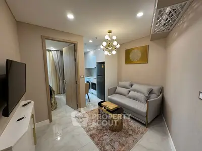 Modern living room with elegant decor and open kitchen layout