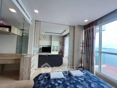 Stunning bedroom with ocean view and modern decor in luxury apartment