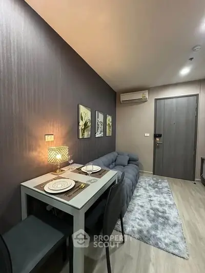 Modern living room with cozy sofa and dining area in stylish apartment