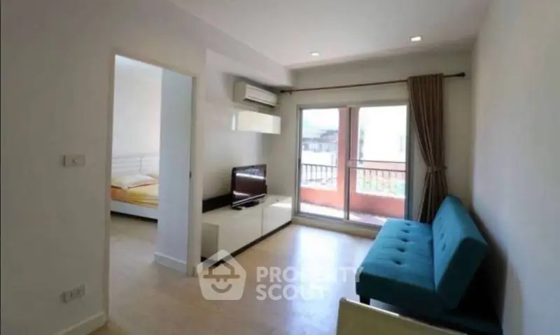 Modern living room with balcony access and stylish furniture