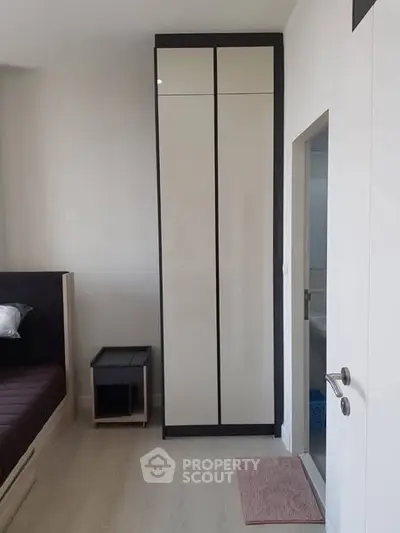 Modern bedroom with sleek wardrobe and minimalist design