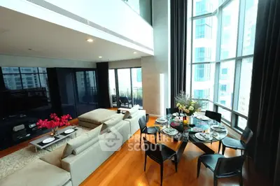 Luxurious modern living room with floor-to-ceiling windows and elegant dining area.