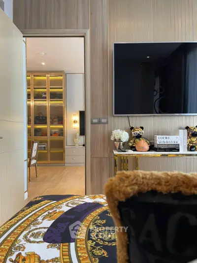 Luxurious bedroom with stylish decor and open view to elegant study area.