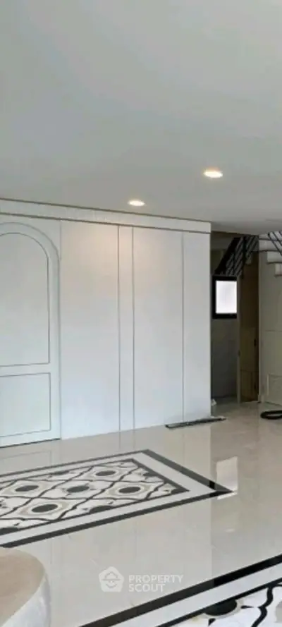 Spacious modern living room with elegant flooring and minimalist design