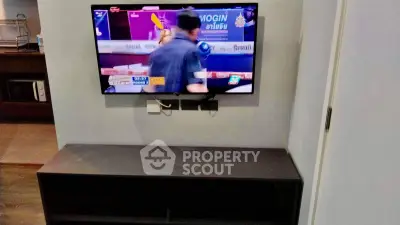 Modern living room with wall-mounted TV and sleek console table