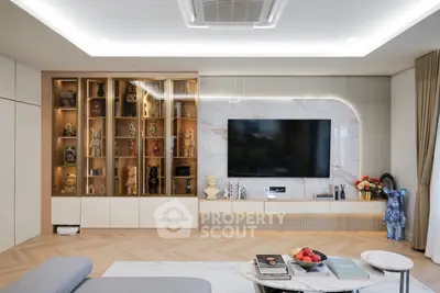 Luxurious modern living room with elegant decor and built-in display shelves