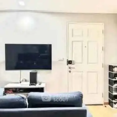 Modern living room with sleek TV setup and stylish furniture