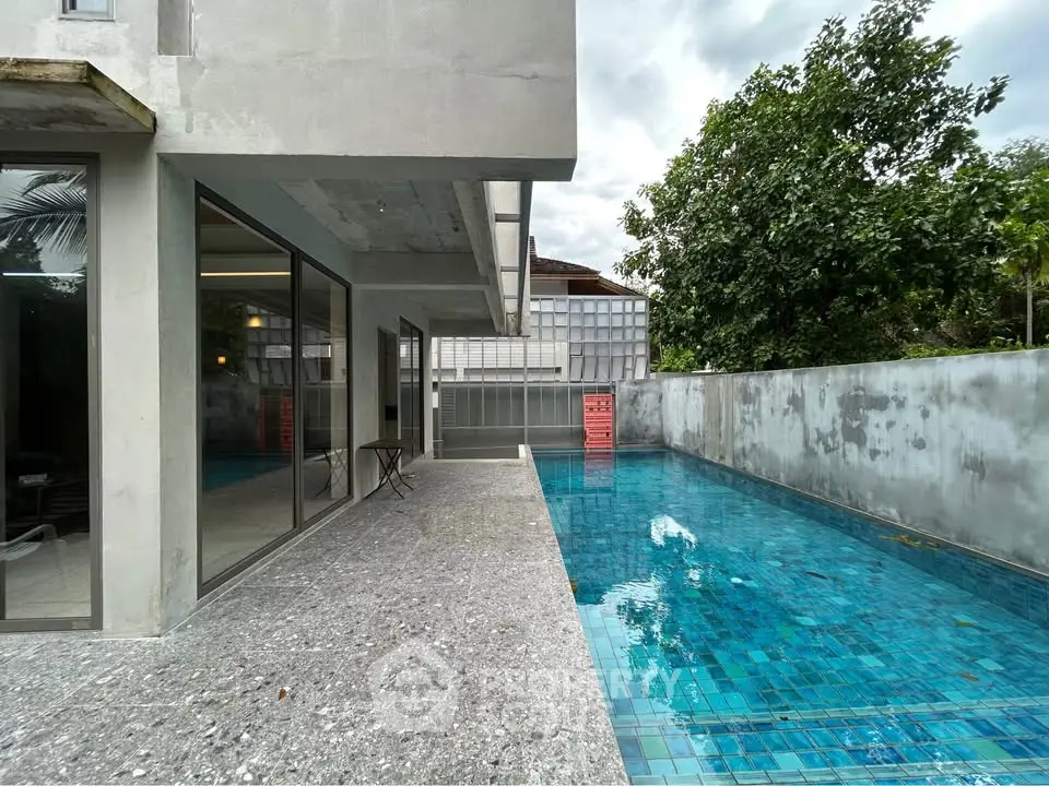 Modern home with sleek pool and spacious patio, perfect for luxury living.