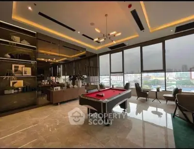 Luxurious living room with pool table and stunning city view