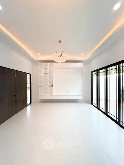 Spacious modern living room with elegant lighting and large windows