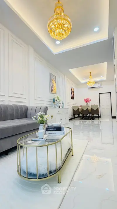 Luxurious living room with elegant chandelier and modern decor