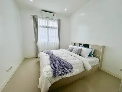 Bright and cozy bedroom with modern furnishings and natural light