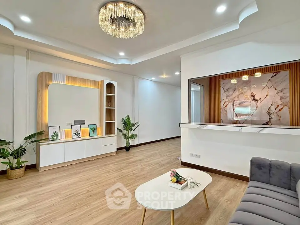 Elegant living room with modern decor and stylish chandelier