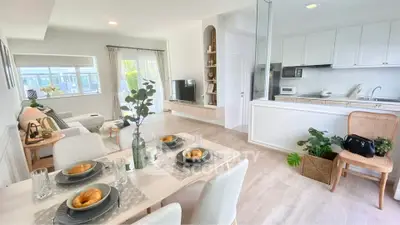 Modern open-plan living and dining area with stylish decor and natural light.