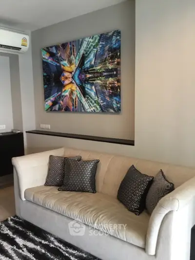 Modern living room with stylish sofa and vibrant cityscape artwork, perfect for urban living.
