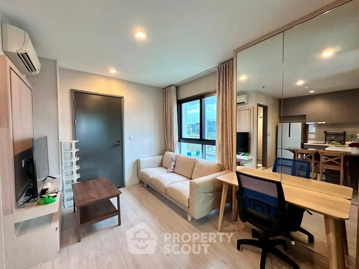 Modern living room with cozy sofa and dining area in open layout apartment