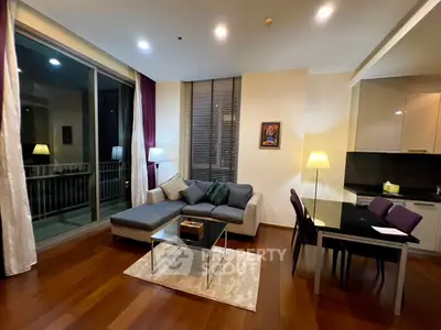 Modern living room with cozy seating and elegant dining area in a stylish apartment.