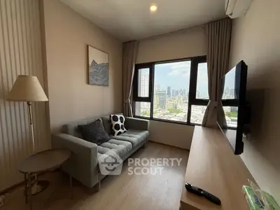 Modern living room with city view, featuring a cozy sofa and wall-mounted TV.