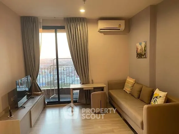 Cozy living room with balcony view and modern furnishings