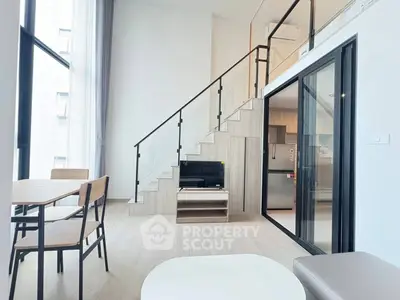 Modern duplex apartment with sleek interior design and open layout