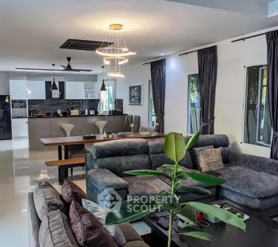 Spacious modern living room with open kitchen and stylish decor