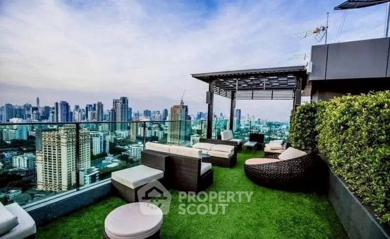 Stunning rooftop terrace with panoramic city views and modern outdoor seating.